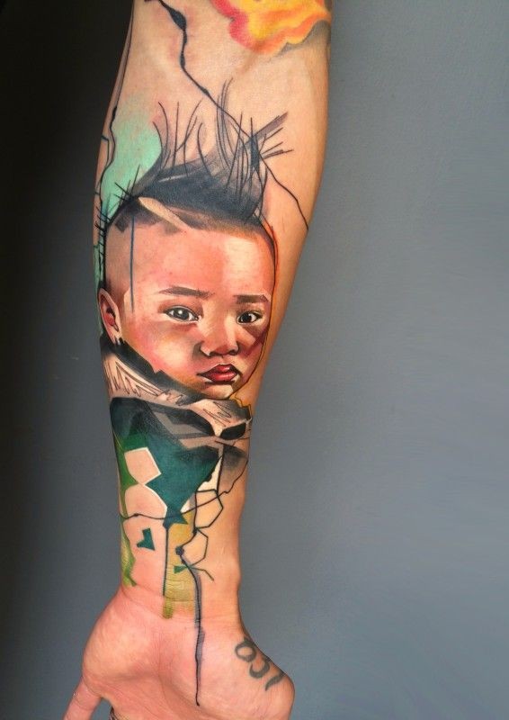 Colorful portrait of a child forearm tattoo by Ivana Belakova