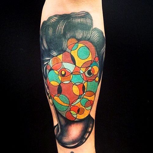 Colorful portrait of a girl colorful abstraction forearm tattoo