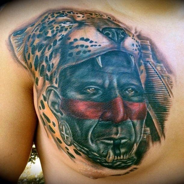 Colorful portrait of aztec sacrificer in a helmet with a leopard head tattoo on chest
