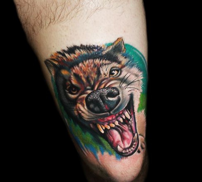 Colorful portrait of furious wolf tattoo