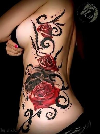 Colorful red roses with skull tattoo on ribs
