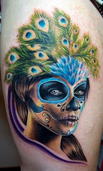 Colorful santa muerte in a headdress of peacock feathers tattoo