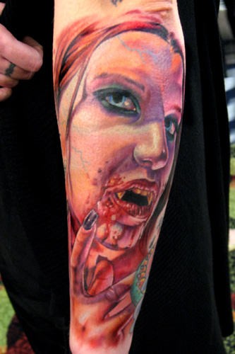 Colorful scary lady vampire forearm tattoo