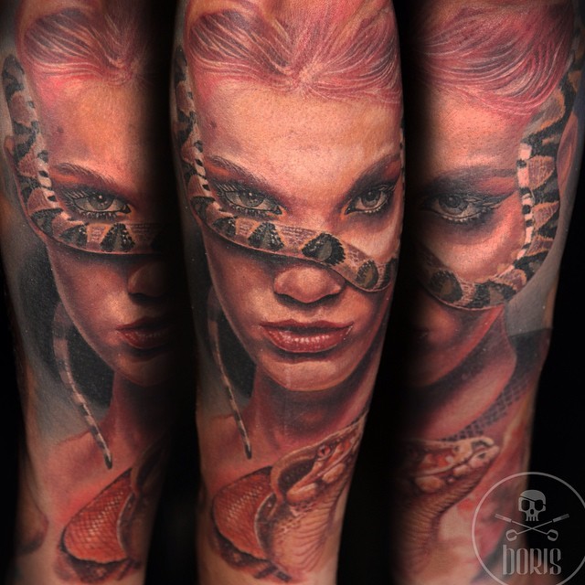 Colorful very detailed woman face with snakes tattoo