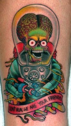 Coloured alien in a spacesuit tattoo