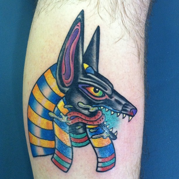 Coloured anubis tattoo on leg