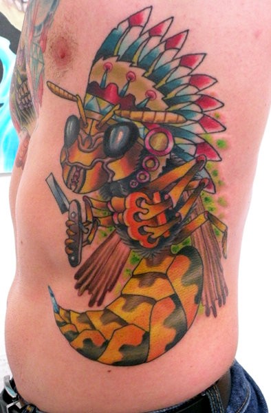 Coloured bee in an indian headdress tattoo