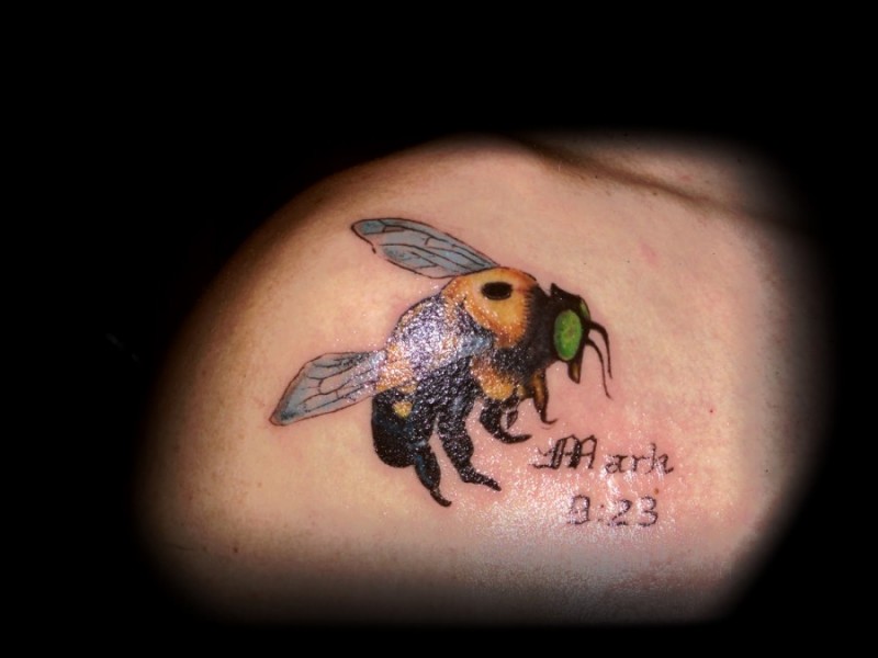 Coloured bee tattoo