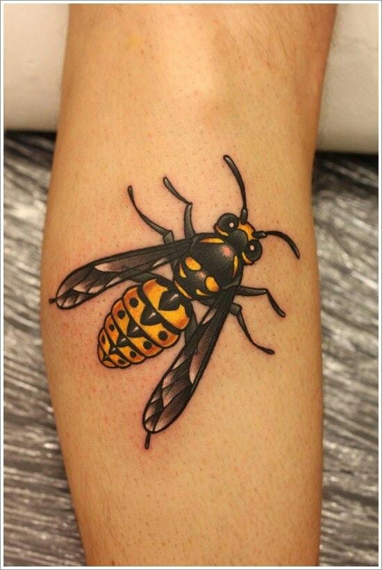 Coloured bee tattoo on leg