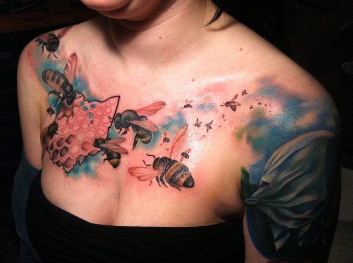 Coloured bees and honeycomb tattoo on chest