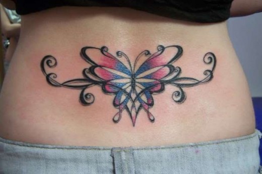 Coloured butterfly tattoo on lower back
