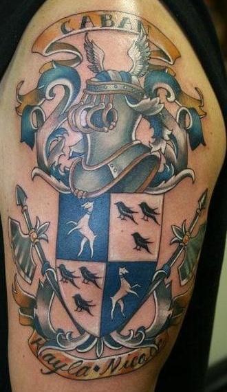 Coloured caban family crest tattoo on shoulder