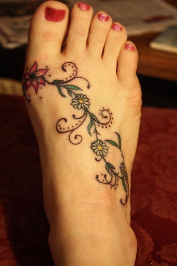 Coloured flower vine tattoo on foot