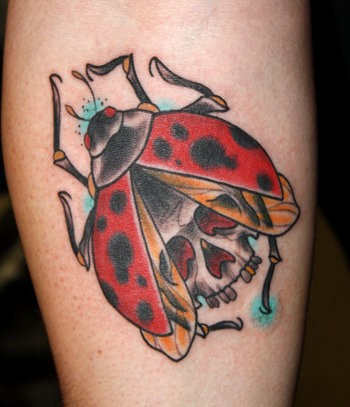Coloured ladybug skull tattoo on leg
