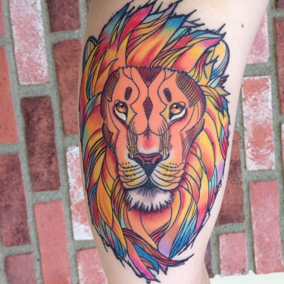 Coloured lion head tattoo by Jamie Lee Parker