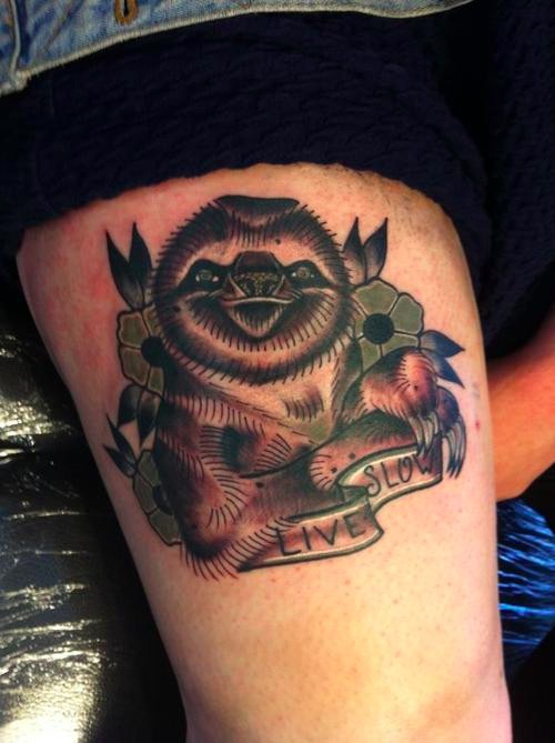 Coloured live slow sloth tattoo on hip