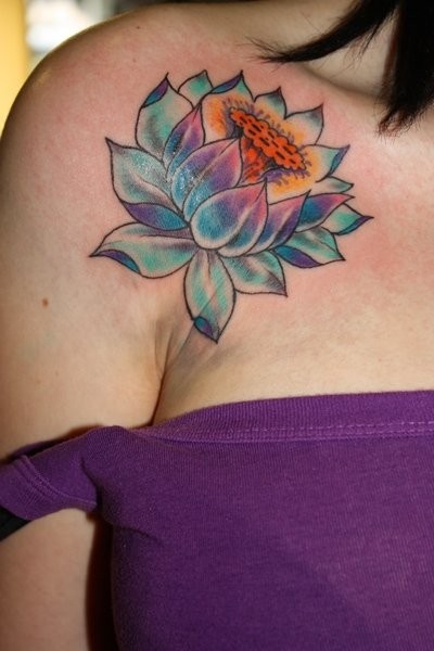 Coloured lotus tattoo on shoulder for women