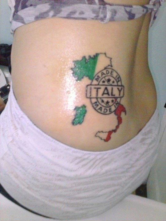 Coloured made in italy tattoo on lower back