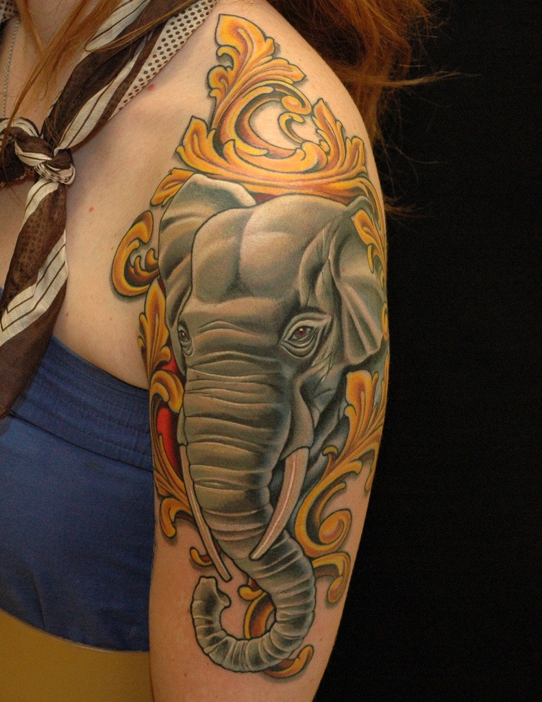 Coloured nice elephant tattoo on half sleeve