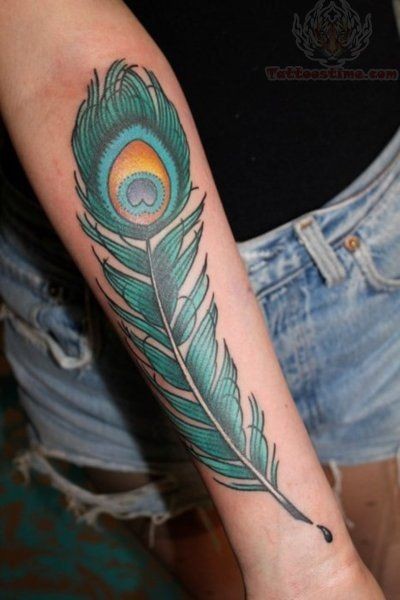 Coloured green peacock feather forearm tattoo