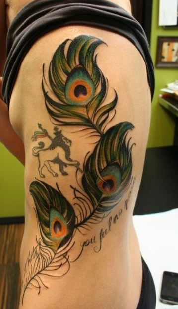 Coloured peacock feathers with lion tattoo on ribs