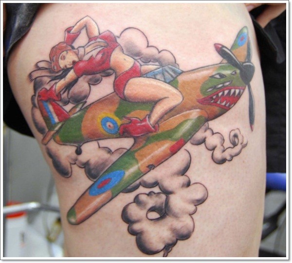 Coloured pin up aviatress girl tattoo on thigh