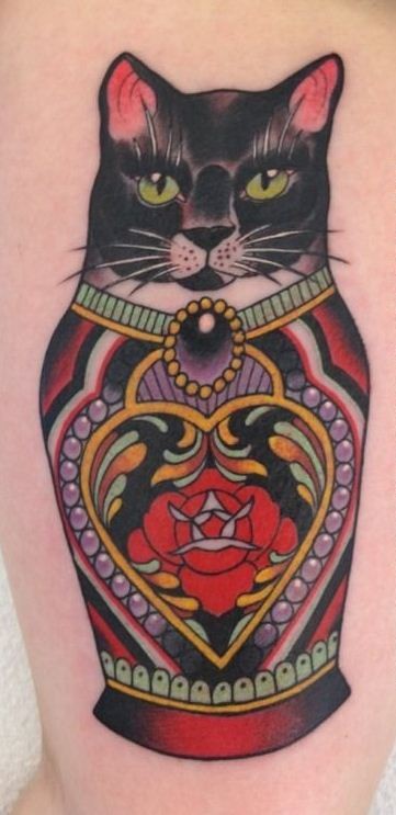 Coloured russian matryoshka cat tattoo