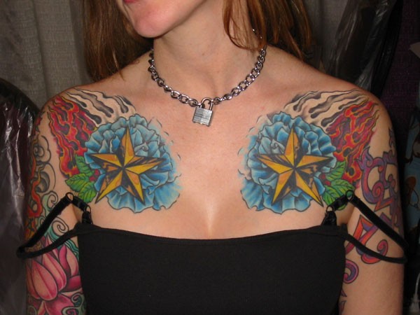 Coloured starfishes chest tattoo