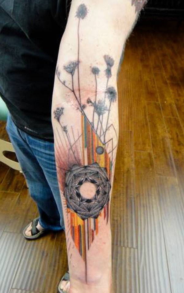 Coloured wildflowers and geometric shapes tattoo on forearm