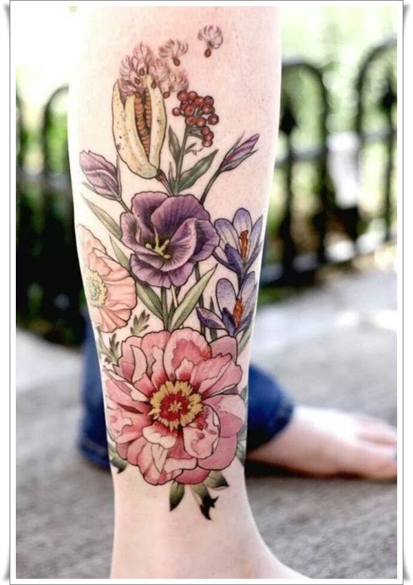 Coloured wildflowers tattoo on leg
