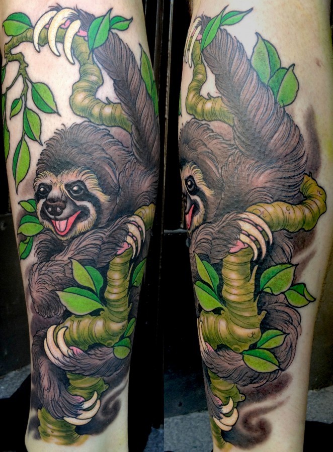 Colourful sloth on tree tattoo