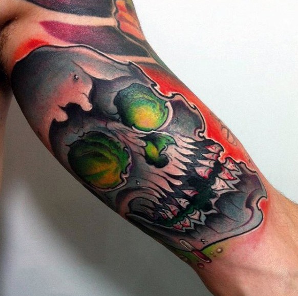 Comic books style colored biceps tattoo of demonic skull