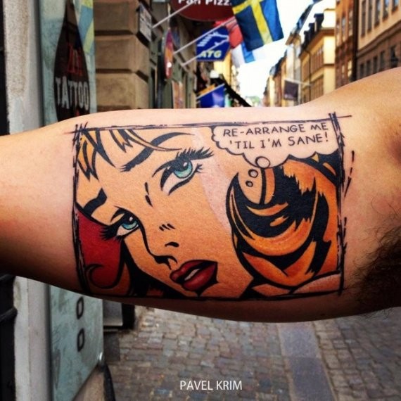 Comic books style colored biceps tattoo of woman with lettering