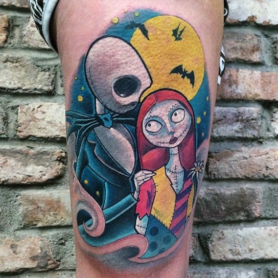 Comic books style colored Nightmare before Christmas heroes couple tattoo on thigh with moon and bats