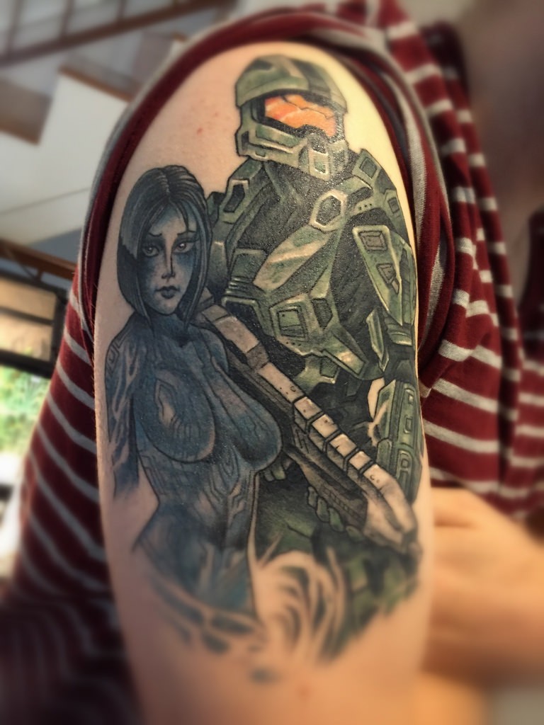 Comic books style colored shoulder tattoo of various video games heroes