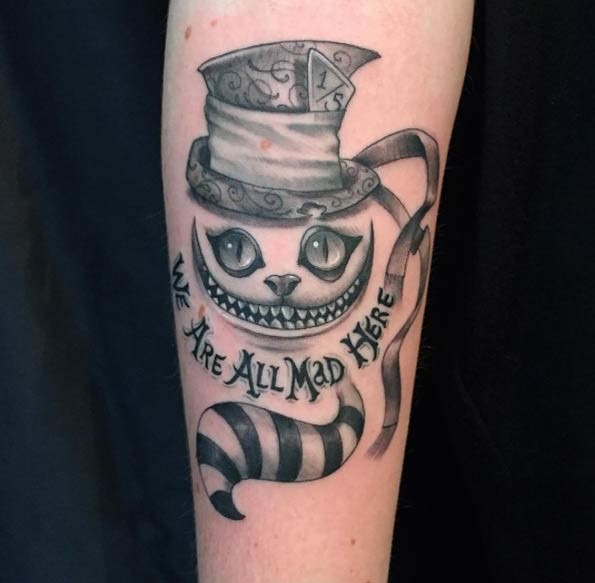 Cool 3D like black and white fantasy cat tattoo on forearm with lettering