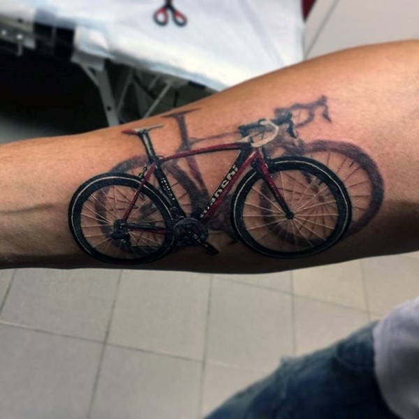 Cool 3D realistic colored mountain bike tattoo on arm