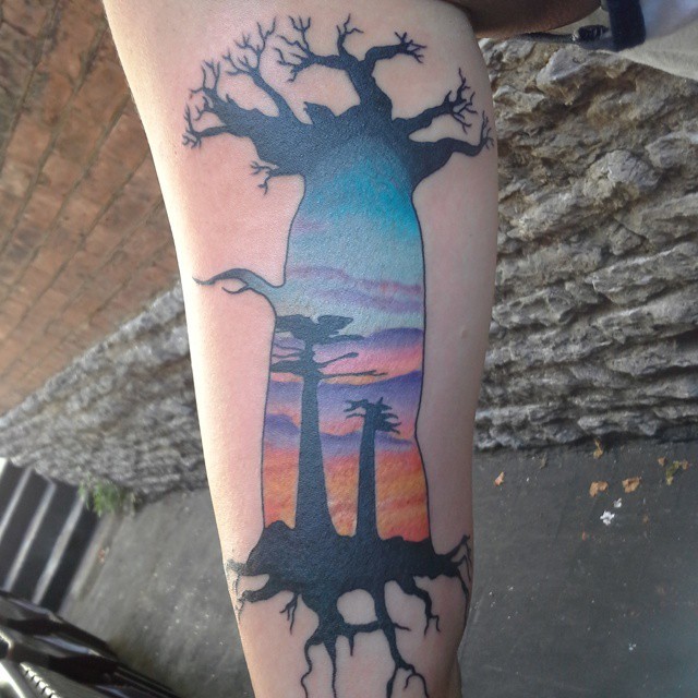 Cool accurate designed baobab tree shaped tattoo stylized with desert sunset