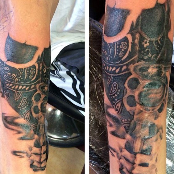 Cool black and gray style thug skull tattoo on forearm combined with revolver pistol