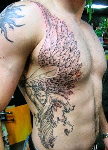 Cool black and white antic justice statue with wings tattoo on side