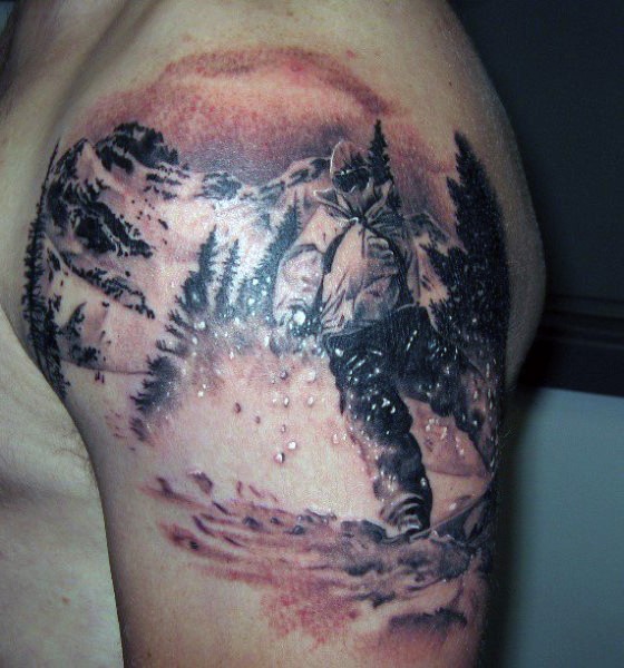Cool black and white modern snowboarder in mountains shoulder area tattoo