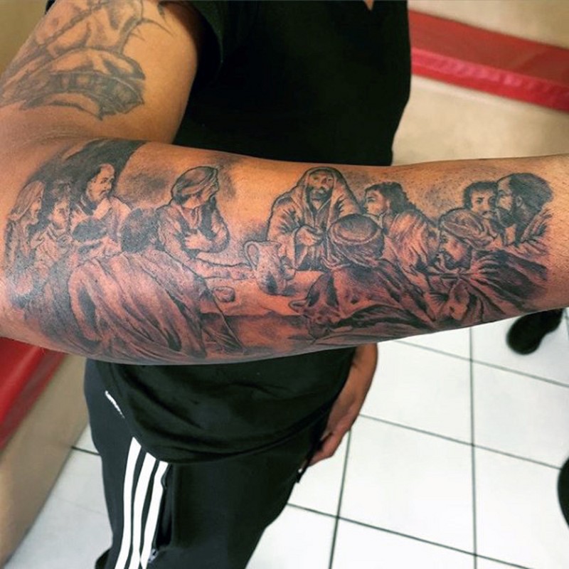 Cool black and white The Last Supper picture tattoo on arm