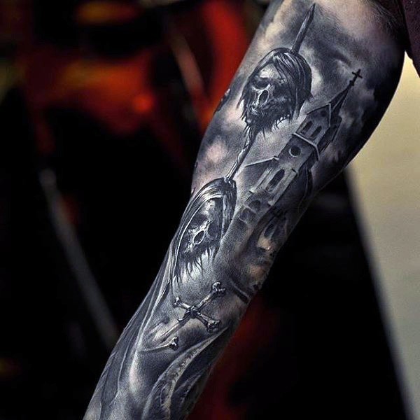 Cool black ink horror style forearm tattoo of human heads in spear and old creepy house