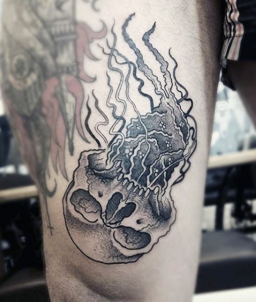 Cool black ink skull shaped jellyfish tattoo on arm