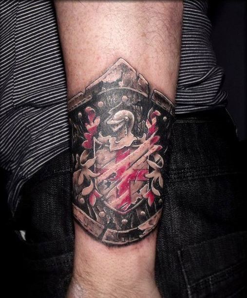 Cool black red family crest tattoo on wrist
