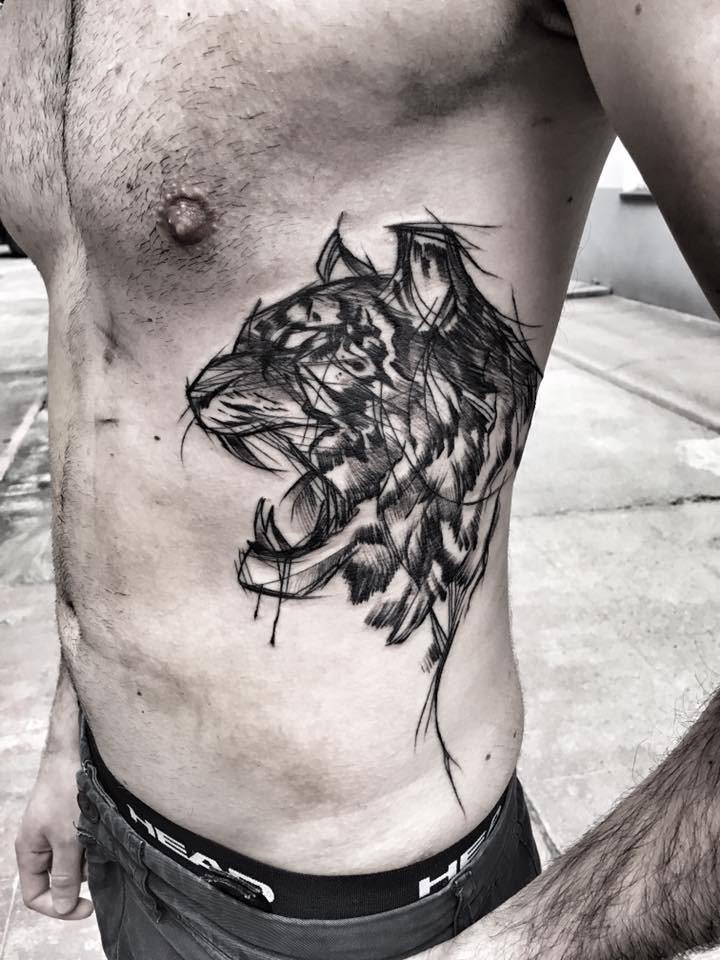 Cool blackwork style side tattoo of angry tiger by Inez Janiak