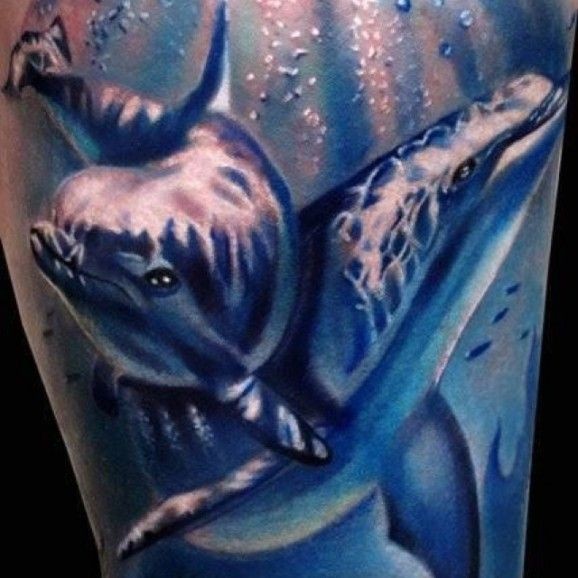 Cool blue whales tattoo on thigh