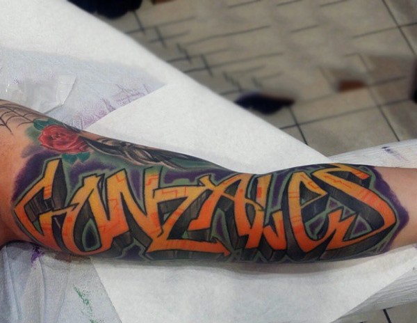 Cool colored graffiti lettering volume tattoo on arm