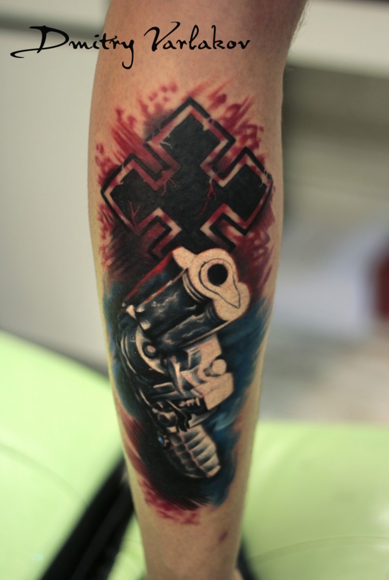 Cool combined and colored arm tattoo of big pistol and cross