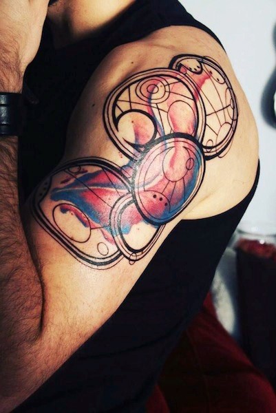 Cool designed big colored geometrical upper arm tattoo